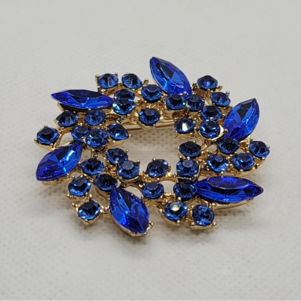 Gold Brooch with blue crystals